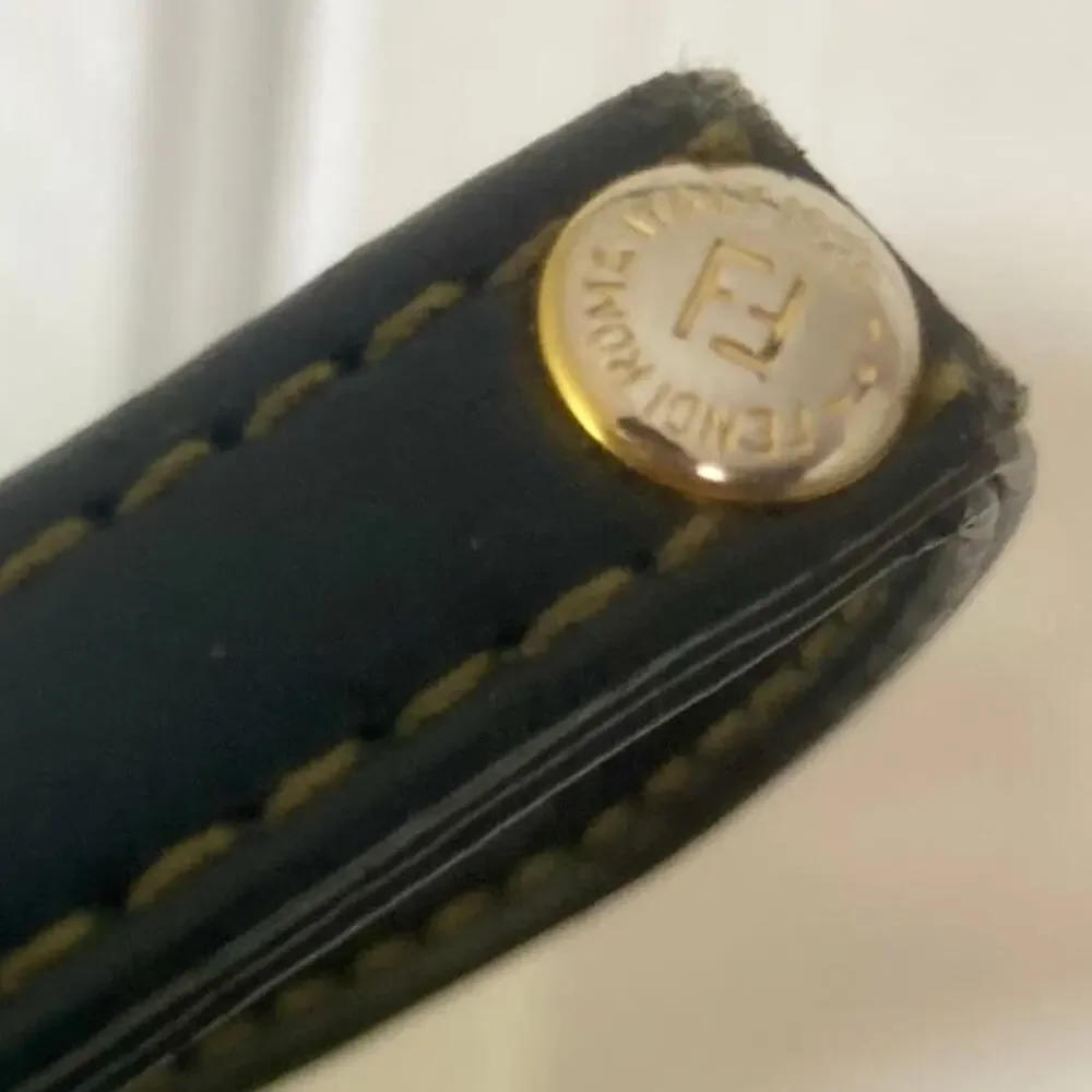 Upcycled leather logo bracelet, gold tone Fendi logo hardware purse strap